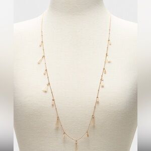 Gold tone tassel & bead necklace